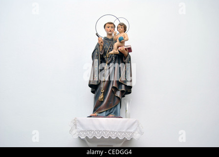 saint peter figurine holding baby jesus Stock Photo