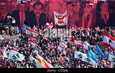 The faces of assassinated politicians form the backdrop of a political rally held in Martyrs Square, Beirut, Lebanon Stock Photo