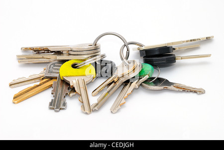 Set of old house keys isolated on the white background. Stock Photo