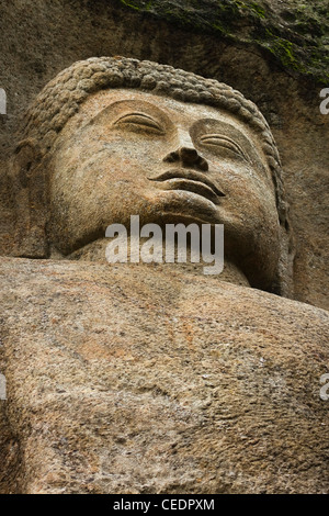 11 meter Buddha statue (unfinished - reason not known) at the 1stC B.C. Dowa Temple on the road to Ella; Bandarawela, Sri Lanka Stock Photo