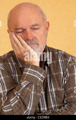 Elderly man with closed eyes Stock Photo