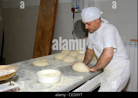 Italy, Basilicata, Roccanova, bakery, baker kneading bread Stock Photo