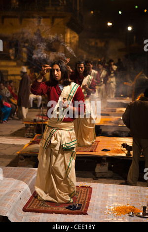India, Uttar Pradesh, Varanasi, Dasaswamedh Ghat, Ganga Aarti vedic puja ceremony priests burning incense Stock Photo
