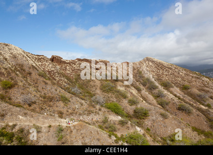 Waikiki, HI - JANUARY 15: Tourists climbing to summit of Diamond Head crater on January 15, 2012. The path gains 560 feet from the crater floor. Stock Photo