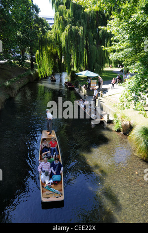 Visitors enjoying a punting experience on a punt on the Avon river in the centre of Christchurch, New Zealand Stock Photo