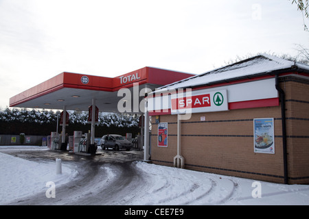 TOTAL petrol station forecourt with SPAR supermarket on a winters day Nottingham England UK