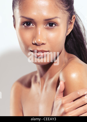 License and prints at MaximImages.com - Expressive beauty portrait of a young exotic woman with long brown hair