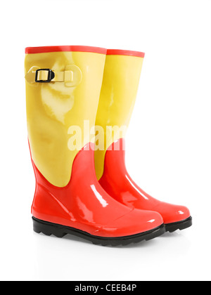 Cute colorful red yellow wellies rain rubber boots isolated on white background Stock Photo