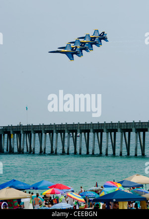 The U.S. Navy flight demonstration squadron, the Blue Angels, perform the “Diamond 360” maneuver during the Pensacola Beach Air Show. The show was part of the 2011 show season and in celebration of the Centennial of Naval Aviation. Stock Photo