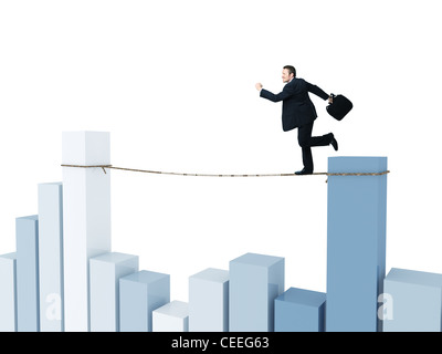 businessman run on rope with financial chart background Stock Photo