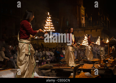 India, Uttar Pradesh, Varanasi, Dasaswamedh Ghat, Ganga Aarti vedic puja ceremony priests with temple lamps Stock Photo