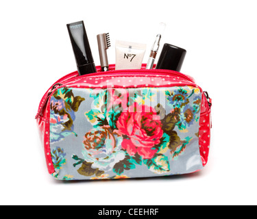 Makeup bag with cosmetics on white background, UK Stock Photo