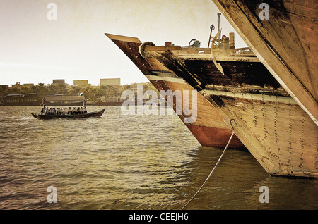 The bows of traditional wooden trading dhows moored in Dubai Creek, UAE. Stock Photo