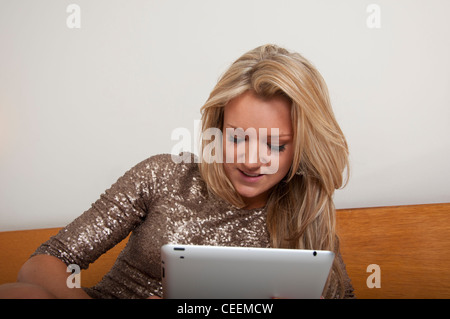 Young woman using a tablet computer Stock Photo