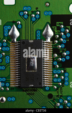 Microchip on green printed circuit board Stock Photo