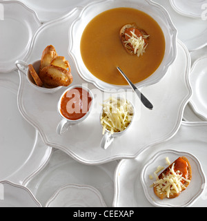 Lobster bisque soup crouton overhead white plates Stock Photo