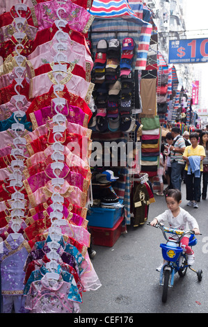 dh Ladies Market MONG KOK HONG KONG Chinese silk pyjamas market stall display child on bike market china street tung choi mongkok toddler city Stock Photo