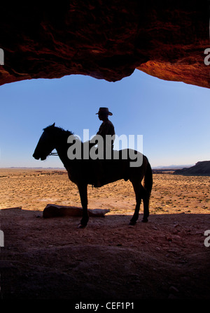 Silhouette of a man riding his horse on the beach at sunset Stock Photo ...