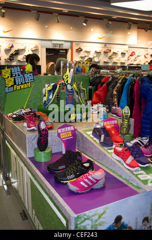 dh Time Square Mall CAUSEWAY BAY HONG KONG Chinese Sport clothes Shopping sports shop trainer shoes display china kit retail Stock Photo