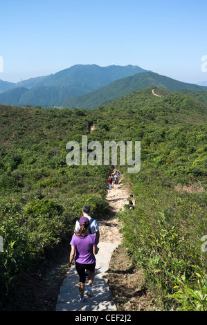 dh Shek o Country park DRAGONS BACK HONG KONG Hiking couple walking footpath parkland country side island hike trail china walkers Stock Photo