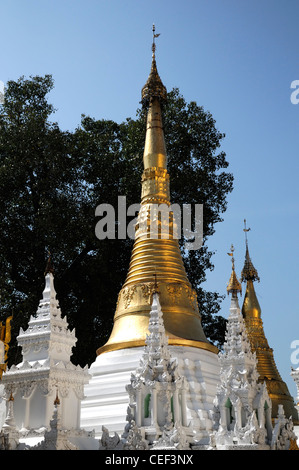 gold golden top topped white stupa stupas buddhist shrine buddhism Shwedagon Pagoda Myanmar Burma Yangon Rangoon Stock Photo