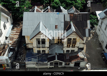 old colonial style wooden house tin galvanised galvanise metal roof Myanmar Burma Yangon Rangoon Stock Photo