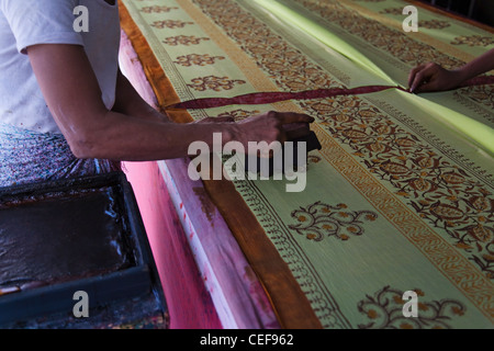 Woman doing block print on fabric, Jaipur, Rajasthan, India Stock Photo