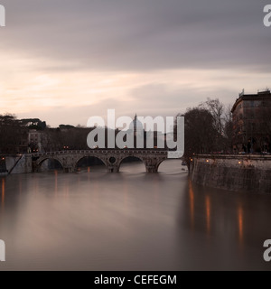 Time lapse view of bridge over river Stock Photo