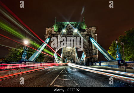 Traffic trails passing over Tower Bridge through the archways Stock Photo