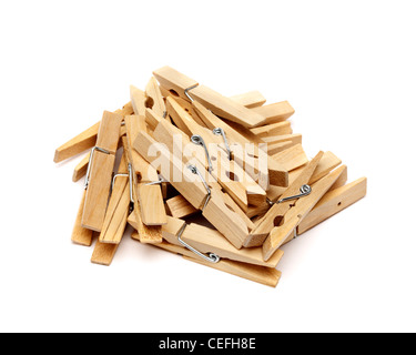 Wooden clothes peg pile on white background Stock Photo