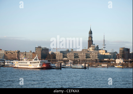 Hamburg skyline seen from its port with paddlesteamer, Gruner & Jahr publishing, St. Michaelis church, high-rail metro and television tower Stock Photo