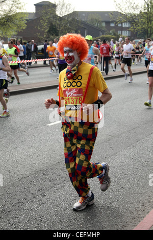 Runner dressed as a clown in the 2011 Virgin London Marathon Stock Photo