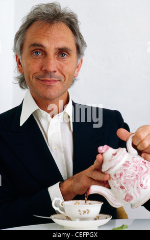 Terence Stamp English actor and author pours a cup of tea Stock Photo