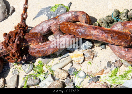 Mousehole, Cornwall, detail study of old rusty anchor chain off a fishing boat on beach at Mousehole Stock Photo