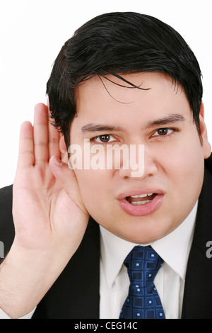 Young business man listening something isolated on white background Stock Photo