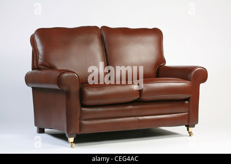 Traditional brown leather sofa on a white background Stock Photo