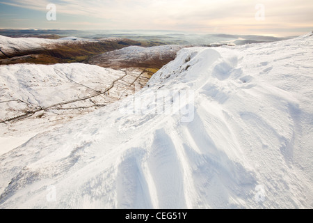 Drifting snow on the summit of Red Screes in the Lake District, UK. Stock Photo