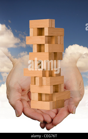 Holding Building Blocks. Stock Photo