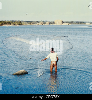 Sri Lanka fisherman casting a net at Yala Stock Photo
