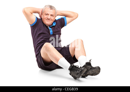 A middle age senior man exercising isolated on white background Stock Photo