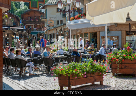 Street cafe in Megève village. Haute-Savoie department in the Auvergne-Rhône-Alpes region in south-eastern France Stock Photo