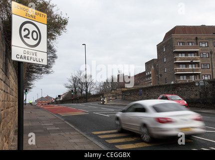 A car speeds past a 20 mph speed limit sign North Shields north east England, UK Stock Photo