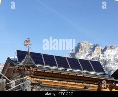 Solar panels on the roof of a restaurant on the piste, winter, in the Italian Dolomites Stock Photo