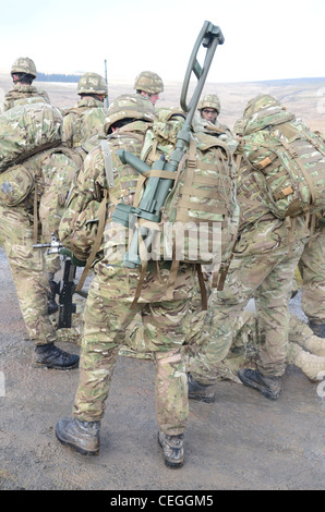 A British army solder 'Vallon man' looking for IED's using a Vallon metal detector, he will lead a patrol, sweeping the route fo Stock Photo