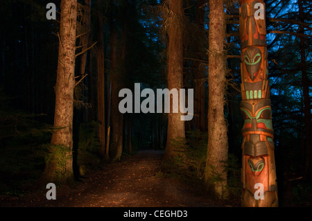 Trail through forest & totem pole in Sitka National Historic Park, Sitka, Alaska Stock Photo