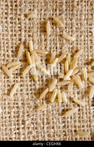 Brown rice on a textile background Stock Photo