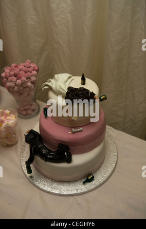 Wedding Cake with drunk bride and groom figures Stock Photo