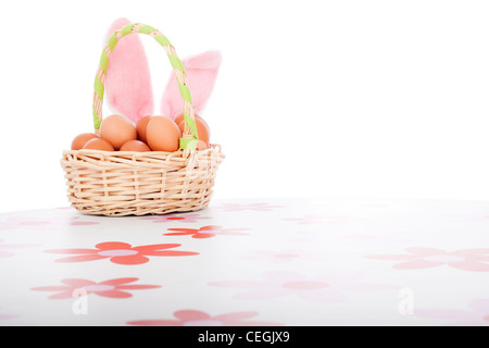 Easter basket with eggs, decoration with copy space, isolated on white background. Stock Photo