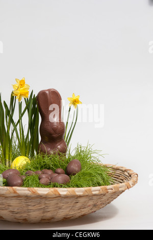 Happy Easter chocolate candies eggs and a Bunny unwrapped pictures images photos very high resolution vertical format in USA US hi-res Stock Photo