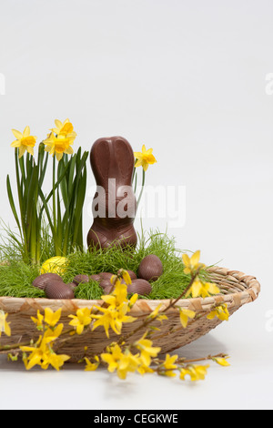 Happy Easter chocolate candies eggs and a Bunny unwrapped pictures images photos sale for on alamy vertical format in USA US hi-res Stock Photo